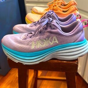 2 pair of Hoka Bondi Women’s running shoes. Both size 7